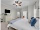 Bedroom featuring white dresser, ceiling fan, carpet, and a walk-in closet at 15934 Sorawater Dr, Lithia, FL 33547