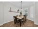 Traditional dining room featuring wood floors, shutters, and a chandelier above the dining table at 15934 Sorawater Dr, Lithia, FL 33547