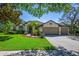 Beautiful single-story home with well-maintained landscaping, a three-car garage, and a circular driveway at 15934 Sorawater Dr, Lithia, FL 33547
