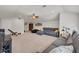 Spacious living room with vaulted ceiling, neutral carpet, and a comfortable sectional sofa at 15934 Sorawater Dr, Lithia, FL 33547