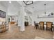Open-concept living and dining area with views of the outdoor seating, perfect for entertaining at 15934 Sorawater Dr, Lithia, FL 33547