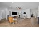 This open living room features hard wood floors, white walls, and cozy furnishings at 15934 Sorawater Dr, Lithia, FL 33547