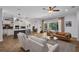 Bright and airy open-concept living space with a modern kitchen and cozy seating area at 15934 Sorawater Dr, Lithia, FL 33547