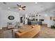 Cozy living room featuring comfortable seating, a modern kitchen island, and stylish decor at 15934 Sorawater Dr, Lithia, FL 33547