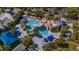 Aerial view of pool and lounge area featuring unique rock features, waterfalls and mature landscaping at 15934 Sorawater Dr, Lithia, FL 33547