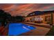Stunning backyard oasis with a sparkling pool, covered patio, and ample seating for outdoor entertaining at 15934 Sorawater Dr, Lithia, FL 33547