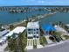 Aerial view of home in a waterfront community with picturesque views of the bay at 16047 Redington Dr, Redington Beach, FL 33708