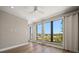 Bedroom featuring hardwood floors, a ceiling fan, and large windows offering lots of natural light and a great view at 16047 Redington Dr, Redington Beach, FL 33708