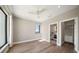 Bright bedroom with recessed lighting, wood floors, a window, and access to a bathroom and closet at 16047 Redington Dr, Redington Beach, FL 33708