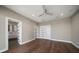 This bedroom features hardwood floors, recessed lighting, bathroom access and closet space at 16047 Redington Dr, Redington Beach, FL 33708