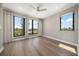 Spacious bedroom features large windows with views and wood flooring at 16047 Redington Dr, Redington Beach, FL 33708