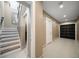 Hallway with stairs, neutral walls, modern doors and a closet at 16047 Redington Dr, Redington Beach, FL 33708