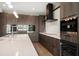 Sleek kitchen with custom cabinetry, modern appliances, and a bright countertop at 16047 Redington Dr, Redington Beach, FL 33708