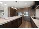 Modern kitchen with island, stainless appliances and custom cabinets at 16047 Redington Dr, Redington Beach, FL 33708