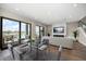 Open living and dining area with large sliding glass doors and modern furnishings at 16047 Redington Dr, Redington Beach, FL 33708