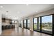 Spacious living area with large windows offering stunning waterfront views at 16047 Redington Dr, Redington Beach, FL 33708