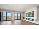 Bright living room with hardwood floors, recessed lighting, and sliding glass doors at 16047 Redington Dr, Redington Beach, FL 33708
