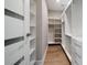 Walk-in closet featuring floor-to-ceiling shelving, hanging rods, and ample storage space at 16047 Redington Dr, Redington Beach, FL 33708