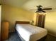 Bright bedroom with cozy carpet and a ceiling fan, with a glimpse to the other rooms at 1710 7Th Sw St # 85, Ruskin, FL 33570