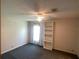 Bedroom showcasing a bright window and built-in shelving, ideal for storage and decor at 1710 7Th Sw St # 85, Ruskin, FL 33570
