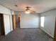 Relaxing bedroom featuring blue walls, ceiling fan, and neutral carpet, perfect for rest and rejuvenation at 1710 7Th Sw St # 85, Ruskin, FL 33570