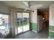 Cozy dining area with sliding glass doors leading to the carport, seamlessly connecting indoor and outdoor spaces at 1710 7Th Sw St # 85, Ruskin, FL 33570