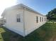 Exterior view of home with well-kept lawn, highlighting its curb appeal at 1710 7Th Sw St # 85, Ruskin, FL 33570
