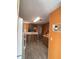 Functional kitchen design with warm color tones, ample cabinet space, and laminate flooring for easy maintenance at 1710 7Th Sw St # 85, Ruskin, FL 33570
