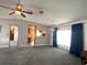 Spacious living room featuring neutral decor, natural light, and comfortable carpeted flooring at 1710 7Th Sw St # 85, Ruskin, FL 33570
