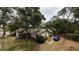 An aerial view of a charming single-Gathering home with mature landscaping at 2033 Aaron Pl, Clearwater, FL 33760