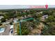 The aerial view demonstrates the property's location near St. Petersburg and its mature, lush landscaping at 2033 Aaron Pl, Clearwater, FL 33760