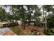 Backyard area including benches, a fire pit, and several sheds at 2033 Aaron Pl, Clearwater, FL 33760