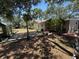 Backyard patio area with seating, landscaping, and privacy fence at 2033 Aaron Pl, Clearwater, FL 33760