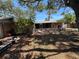Exterior backyard with screened patio, picnic table, and decorative features at 2033 Aaron Pl, Clearwater, FL 33760
