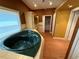Bathroom featuring a green soaking tub and tiled floors at 2033 Aaron Pl, Clearwater, FL 33760