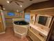 Bathroom features a jetted tub and a sink vanity with a separate shower at 2033 Aaron Pl, Clearwater, FL 33760