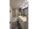 Bathroom featuring a vanity, mirror, toilet and shower/tub combo with a shower curtain at 2033 Aaron Pl, Clearwater, FL 33760