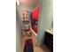 Bathroom includes a vanity with sink and a shower/tub combo with a sports themed curtain and mat at 2033 Aaron Pl, Clearwater, FL 33760