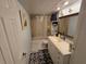 Bathroom featuring a tub, shower, toilet, and a vanity sink with white cabinets at 2033 Aaron Pl, Clearwater, FL 33760