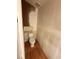 Bathroom with a toilet and damaged wall paint at 2033 Aaron Pl, Clearwater, FL 33760