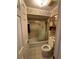 Cozy full bathroom with bath tub, shower with glass door, and toilet at 2033 Aaron Pl, Clearwater, FL 33760