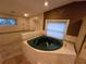 Bathroom features a jetted tub and shower area at 2033 Aaron Pl, Clearwater, FL 33760