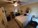 Comfortable bedroom with tile floors, ceiling fan, bright walls and closet with mirrored doors at 2033 Aaron Pl, Clearwater, FL 33760