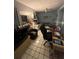 Bedroom featuring gray walls, tile floors, ceiling fan, and decorated with sports memorabilia at 2033 Aaron Pl, Clearwater, FL 33760