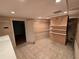 Spacious walk-in closet with shelving, tiled floor, and recessed lighting at 2033 Aaron Pl, Clearwater, FL 33760