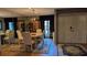 Formal dining room with chandelier, wood floors, and a decorative rug under the table at 2033 Aaron Pl, Clearwater, FL 33760
