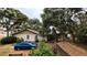 Charming home with a well-manicured front yard and mature trees at 2033 Aaron Pl, Clearwater, FL 33760