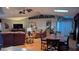 Spacious living room featuring hard wood floors, skylights, and comfortable seating arrangements at 2033 Aaron Pl, Clearwater, FL 33760