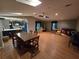 Spacious living room with hardwood floors, skylights, and generous seating at 2033 Aaron Pl, Clearwater, FL 33760