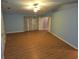 Bright living room with hardwood floors and a ceiling fan at 2033 Aaron Pl, Clearwater, FL 33760